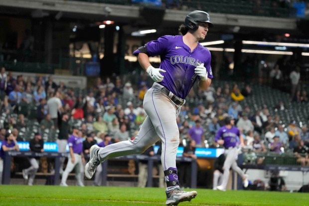 Colorado Rockies' Michael Toglia rounds the bases after hitting a three-run home run during the sixth inning of a baseball game against the Milwaukee Brewers, Friday, Sept. 6, 2024, in Milwaukee. (AP Photo/Kayla Wolf)