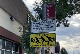 Racist and anti-immigrant signs that also targeted Vice President Kamala Harris popped up Thursday in multiple bus stops along Denver's Colfax Avenue, and transit agencies in at least one other state reported similar incidents.