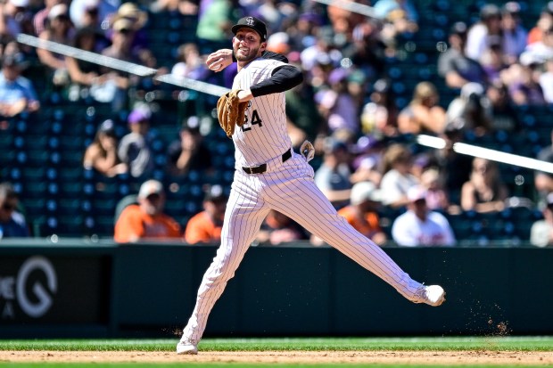 Ryan McMahon #24 of the Colorado Rockies throws to first base after fielding a ground ball in the seventh inning against the Baltimore Orioles at Coors Field on Sept. 1, 2024 in Denver. (Photo by Dustin Bradford/Getty Images)