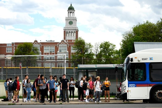 East High School students get ready for their ride home on an RTD bus at 17th Ave and Esplanade in downtown Denver on May 15, 2018 Denver,