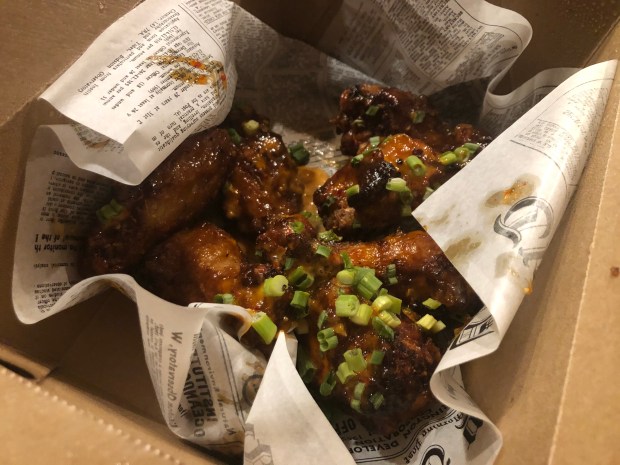 The Lucky Dragon wings with bang bang sauce (sweet Thai chili, garlic aioli, sesame seeds) at Ace Eat Serve's new wing pop-up, Wing Alley, on Nov. 13, 2020 in Uptown Denver.