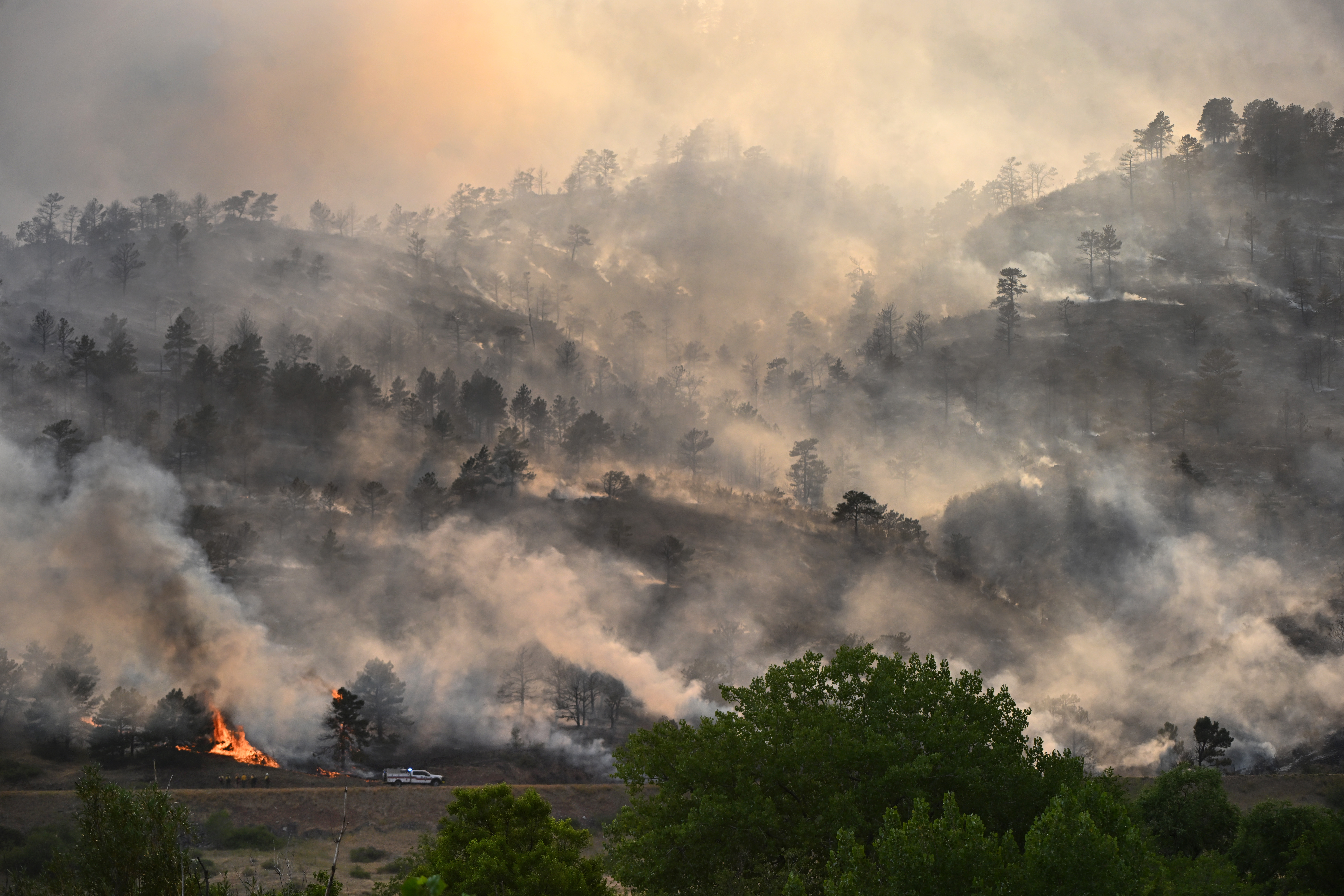 Firefighters work on fighting the Alexander Mountain fire near Sylvan Dale Ranch that continues to burn west of Loveland on July 30, 2024. (Photo by Helen H. Richardson/The Denver Post)