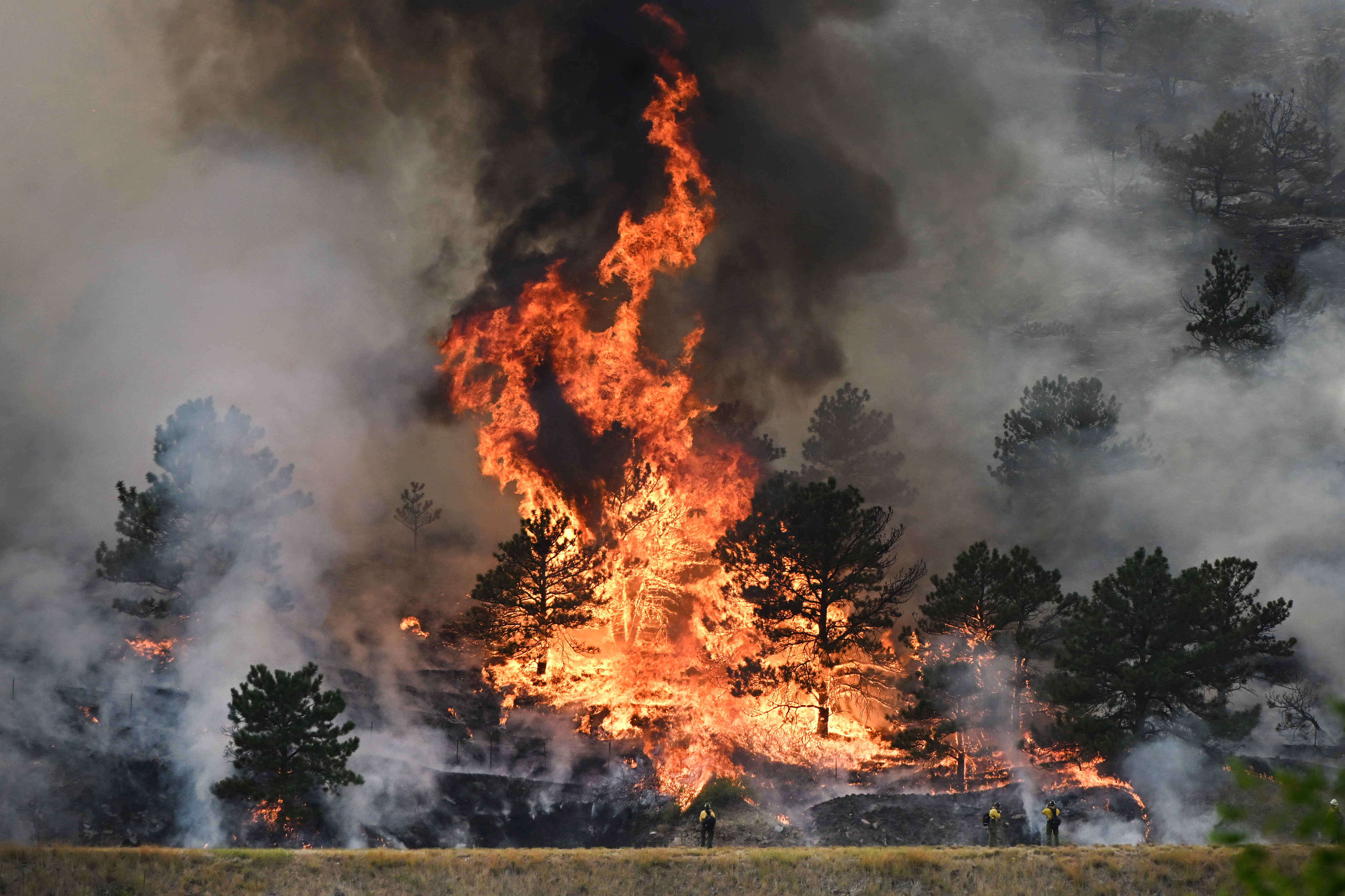 Firefighters work on fighting the Alexander Mountain fire that continues to burn near Sylvan Dale Ranch west of Loveland on July 30, 2024. (Photo by Helen H. Richardson/The Denver Post)