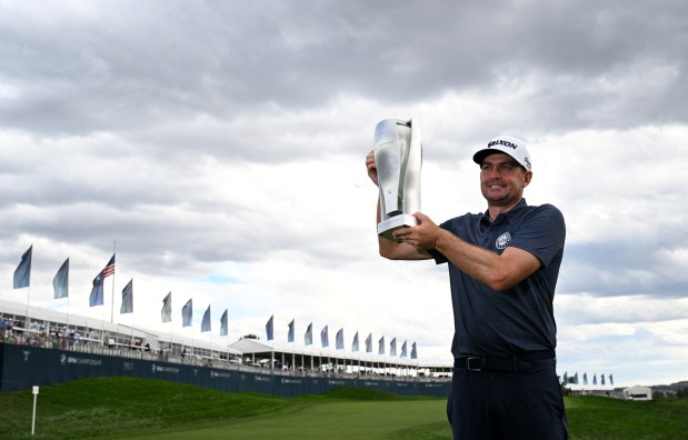 Keegan Bradley holds the BMW Championship trophy on the eighteenth hole after winning the BMW Championship at Castle Pines Golf Club in Castle Rock on Aug. 25, 2024. Bradley bogied the last hole but was still able to hold onto his overall lead. (Photo by Helen H. Richardson/The Denver Post)