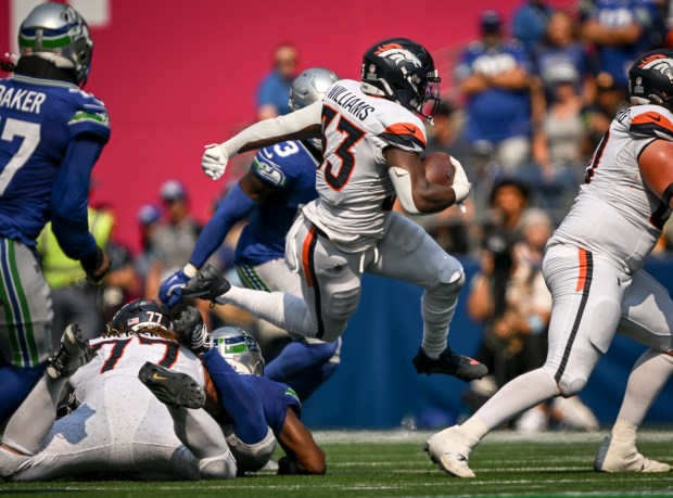 Javonte Williams (33) of the Denver Broncos goes airborne against the Seattle Seahawks during the second quarter at Lumen Field in Seattle, Washington on Sunday, Sept. 8, 2024. (Photo by AAron Ontiveroz/The Denver Post)