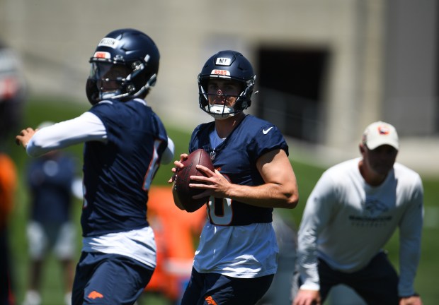 Denver Broncos quarterbacks Zach Wilson (4) and Bo Nix (10) run a drill during minicamp practice at Broncos Park Powered by CommonSpirit in Englewood, Colorado, on Wednesday, June 12, 2024. (Photo by Zachary Spindler-Krage/The Denver Post)