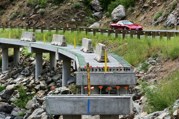 Casted cement beams are installed for the under-construction Clear Creek Canyon trail in Jefferson County on Wednesday, Aug. 14, 2024. (Photo by Hyoung Chang/The Denver Post)