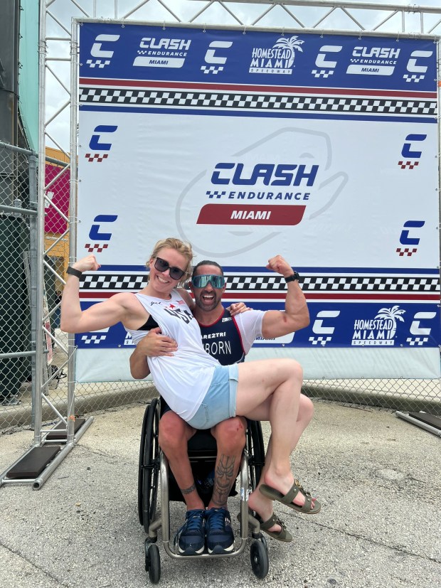 Paralympics triathlete Howie Sanborn, along with his girlfriend, Jayne Williams, celebrates his victory at the Team USA selection race in Homestead, Fla. this spring.