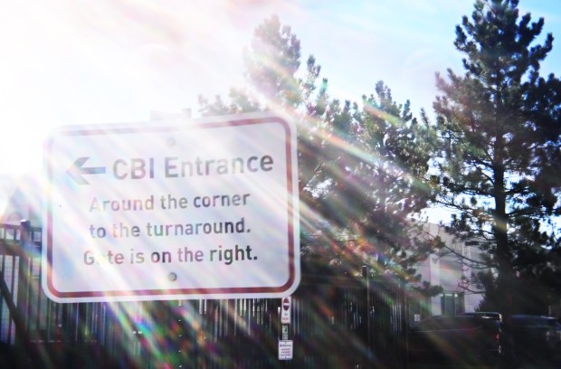 A sign marks the entrance to a Colorado Bureau of Investigation building, where Yvonne "Missy" Woods worked, in Arvada on Aug. 3, 2024. (Photo by RJ Sangosti/The Denver Post)