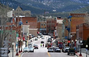 TRINIDAD, COLORADO - MARCH 20: Pedestrians cross the roadway on March 20, 2023 in Trinidad, Colorado. Trinidad near the Colorado and New Mexico state line has around 20 marijuana dispensaries. The state legislature will be considering this spring an implementation bill for Prop 122, which legalized mushroom use in Colorado. (Photo by RJ Sangosti/The Denver Post)