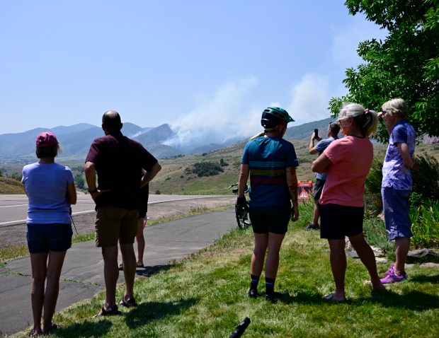 Bystanders watch the Quarry fire near the South Valley Park in Ken Caryl on Wednesday, July 31, 2024. (Photo by Andy Cross/The Denver Post)