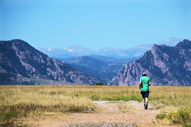 A runner heads up a trail at Rocky Flats National Wildlife Refuge in Superior on Thursday, Aug. 29, 2024. (Photo by Hyoung Chang/The Denver Post)