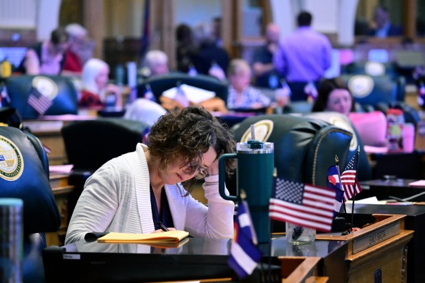 State Rep. Emily Sirota, a Denver Democrat, works as lawmakers consider property tax legislation during the second day of the legislative special session in the House Chamber of the Colorado State Capitol in Denver on Tuesday, Aug. 27, 2024. (Photo by Hyoung Chang/The Denver Post)