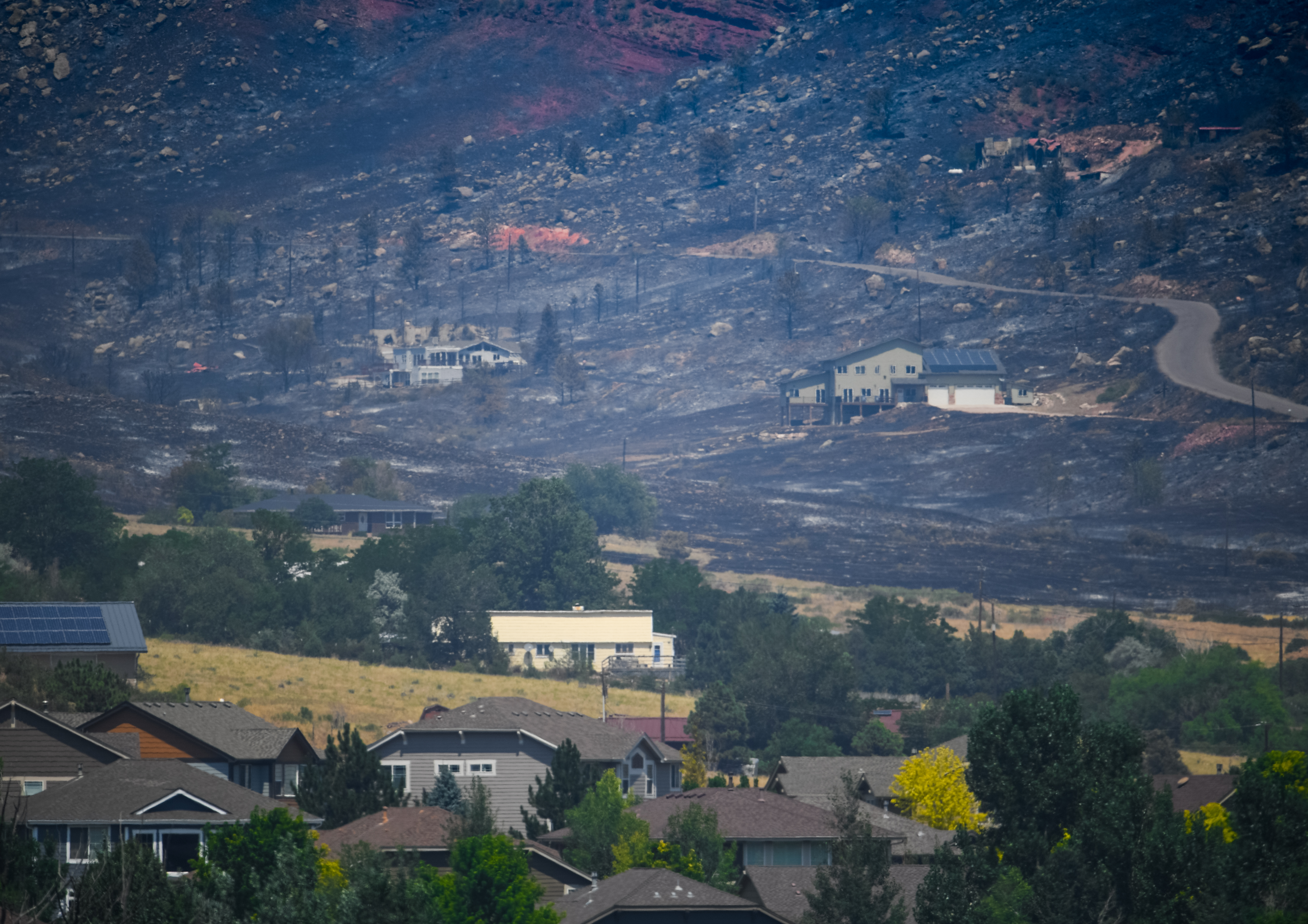 A view from a ridge near Lyons Middle Senior High School shows how close the Stone Canyon fire got to nearby neighborhoods in Lyons, as seen on Thursday, Aug. 1, 2024. (Photo by Zachary Spindler-Krage/The Denver Post)