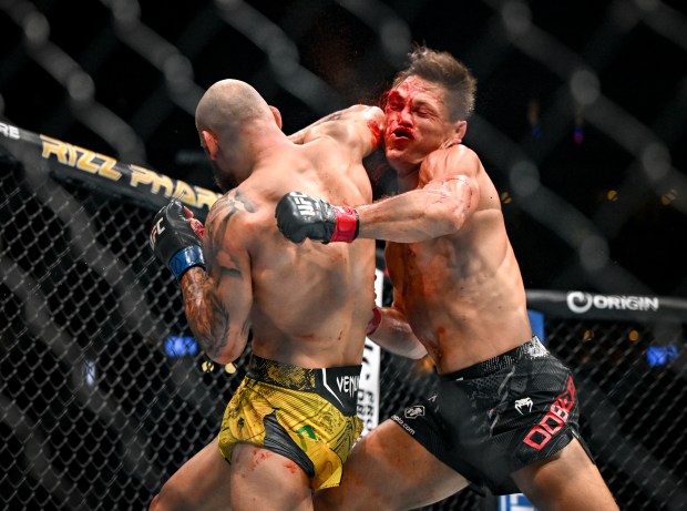 Drew Dober (black trunks) and Jean Silva (black trunks) go to war during a UFC Fight Night lightweight bout at Ball Arena in Denver on Saturday, July, 13, 2024. Silva won the fight by way of a doctor stoppage. (Photo by AAron Ontiveroz/The Denver Post)