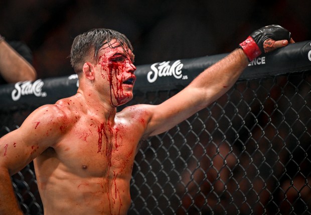 Drew Dober (black trunks) stnads disappointed after his fight was stopped against Jean Silva (black trunks) due to a cut during a UFC Fight Night lightweight bout at Ball Arena in Denver on Saturday, July, 13, 2024. Silva won the fight by way of a doctor stoppage. (Photo by AAron Ontiveroz/The Denver Post)