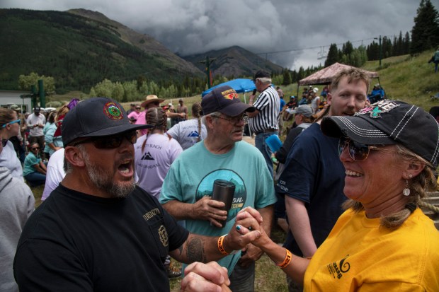 Tug-o-War competitors pump each other up during the Hardrockers' Holidays in Silverton on Saturday, Aug. 10, 2024. (Photo by William Woody/Special to The Denver Post)