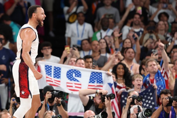 Stephen Curry #4 of Team United States reacts after a basket during a Men's basketball semifinals match between Team United States and Team Serbia on day thirteen of the Olympic Games Paris 2024 at Bercy Arena on Aug. 8, 2024 in Paris, France. (Photo by Ezra Shaw/Getty Images)