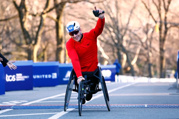 Jetze Plat of the Netherlands crosses the finish line to win the Mens Wheelchair division in United Airlines NYC Half Marathon on March 19, 2023 in New York City. (Photo by Rich Schultz/Getty Images)