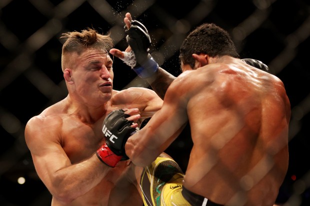 Drew Dober, left, exchanges strikes with Rafael Alves of Brazil in their lightweight bout during UFC 277 at American Airlines Center on July 30, 2022 in Dallas, Texas. (Photo by Carmen Mandato/Getty Images)