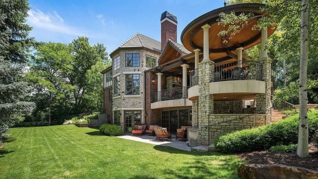 The rear of the home at 17 Polo Club Drive in Denver owned by Brian Griese and his family. It features a two-story loggia with entertaining space and a secluded spa. (Courtesy Leif Smith via BusinessDen)