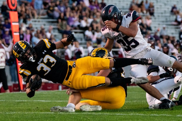 Green Mountain High School's Max Babel (33) slides into the end zone to score a touchdown during the first half of the game at Jeffco Stadium, Friday, Sept. 6 2024, in Lakewood, Colorado. Dakota Ridge High School led the game against Green Mountain High School in the first half. (Rebecca Slezak/Special to The Denver Post)