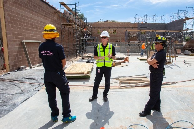 Randy Black, Chief of Durango Fire & Rescue, center, tours the fire district's new downtown Durango fire station under construction at 1235 Camino Del Rio in Durango, Colorado, along with Firefighter/EMT Ian McPherson, left, and Jeff Babcock, Captain, right, on Wednesday, Aug. 28, 2024. (Photo by Shaun Stanley/Special to The Denver Post)